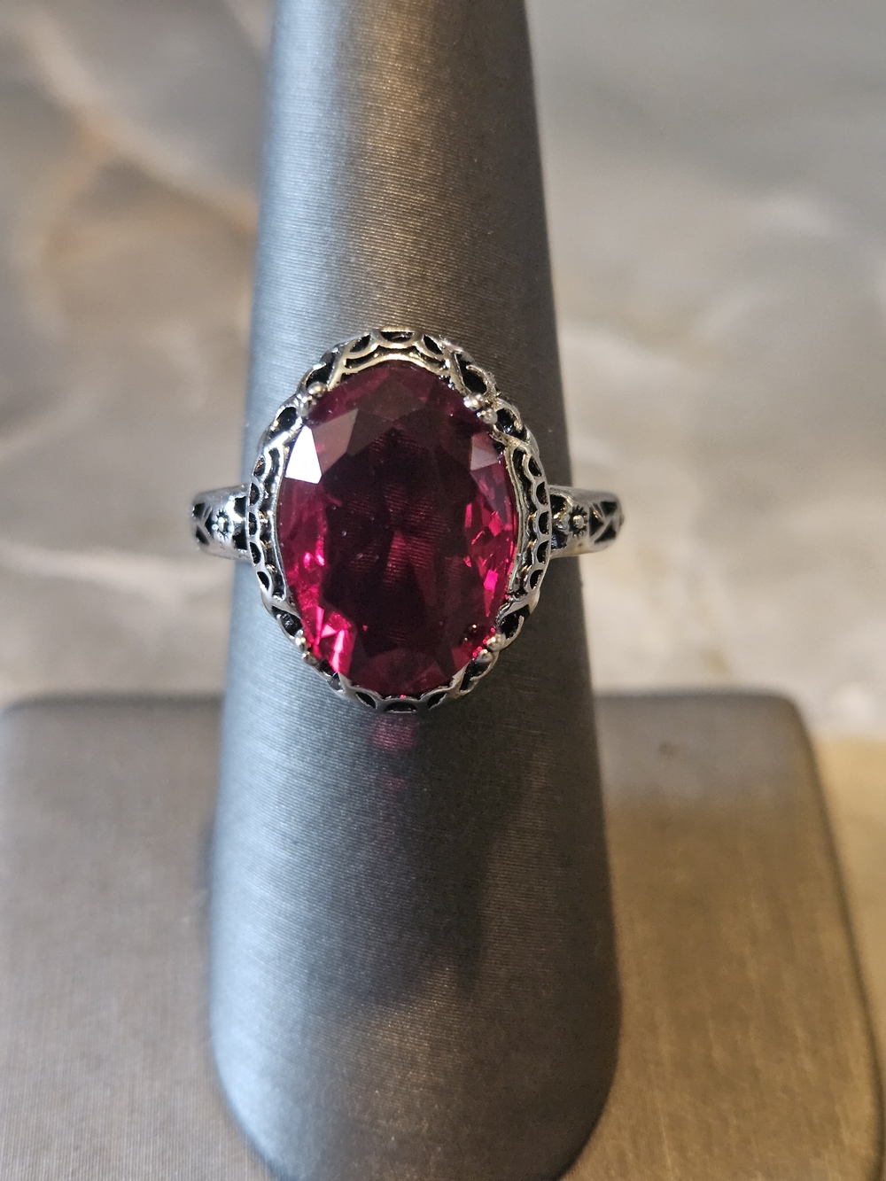Silver Tone Filigree Ring with Deep Red Oval Stone